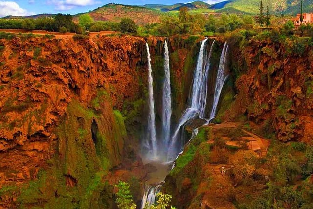 Ouzoud Waterfalls cascading down red cliffs